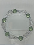 Fancy sliver bead with solid green bracelet