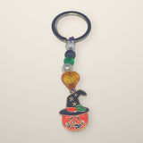 Pumpkin and Green Keychain with a witch hat jack-o-lantern charm, orange heart, green and pearl beads on a silver ring