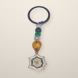 Spiderweb Keychain with a spiderweb charm, orange heart, green and pearl beads on a silver ring