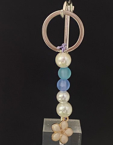  White, dark purple, and light blue pearls with dangling light pink flower Keychain