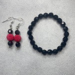 Black bracelet with purple earrings and black bracelet