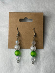 White pearls with one green bead earrings