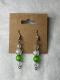 White pearls with one green bead earrings