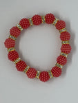 Red orange bracelet with diamonds in between