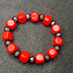 Red squared with black bracelet