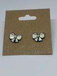 White bow with black outline stud earrings