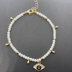 White anklet bracelet with dangling evil eye