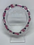  Clear bead with pink swirl with black solid shiny bead