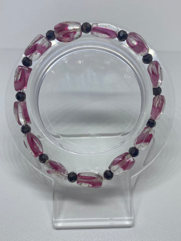  Clear bead with pink swirl with black solid shiny bead
