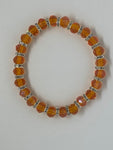 Orange beads with shiny diamonds 