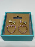 Shiny light pink bow heart earrings 