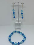 Light blue pearls with dark blue pearl earrings and bracelets