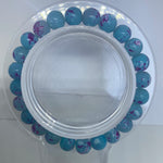 Blue bracelet with purple spots