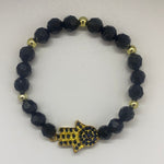 Gold bead with octagon black bead bracelet