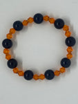 Shiny orange and solid black bracelet