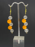 Clear pearl with orange bead Dangling earrings