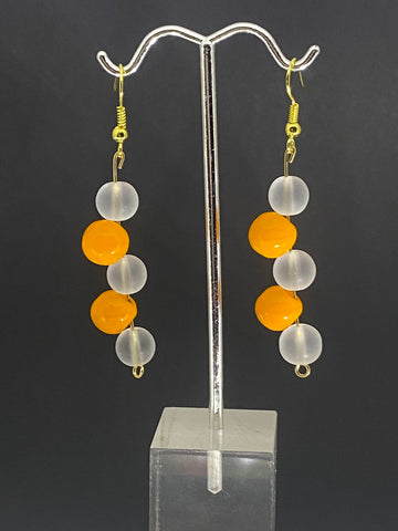 Clear pearl with orange bead Dangling earrings