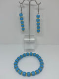 Blue with gold earrings and bracelet