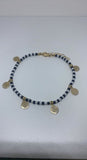 Black and white small beads with dangling happy face ankle bracelet