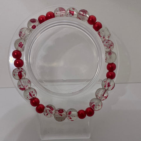 Clear with red spots with red solid bracelet