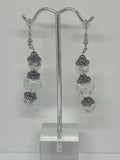 earrings have three shiny clear glass beads with flower crown  