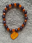 Black and orange shiny beads with pumpkin charm