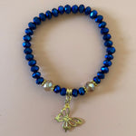 Royal blue bracelet with gold dangling butterfly