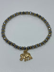 Sliver and gold bracelet with dangling gold elephant